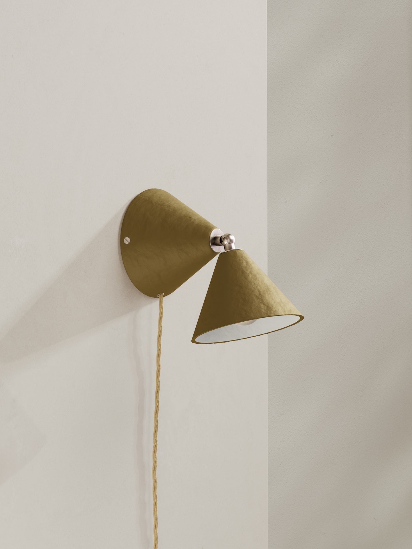 Plug-in Rotor wall light - a conical shaped plug-in wall light, hand-painted in dark green brownish colour with nickel finishes and beige flex
