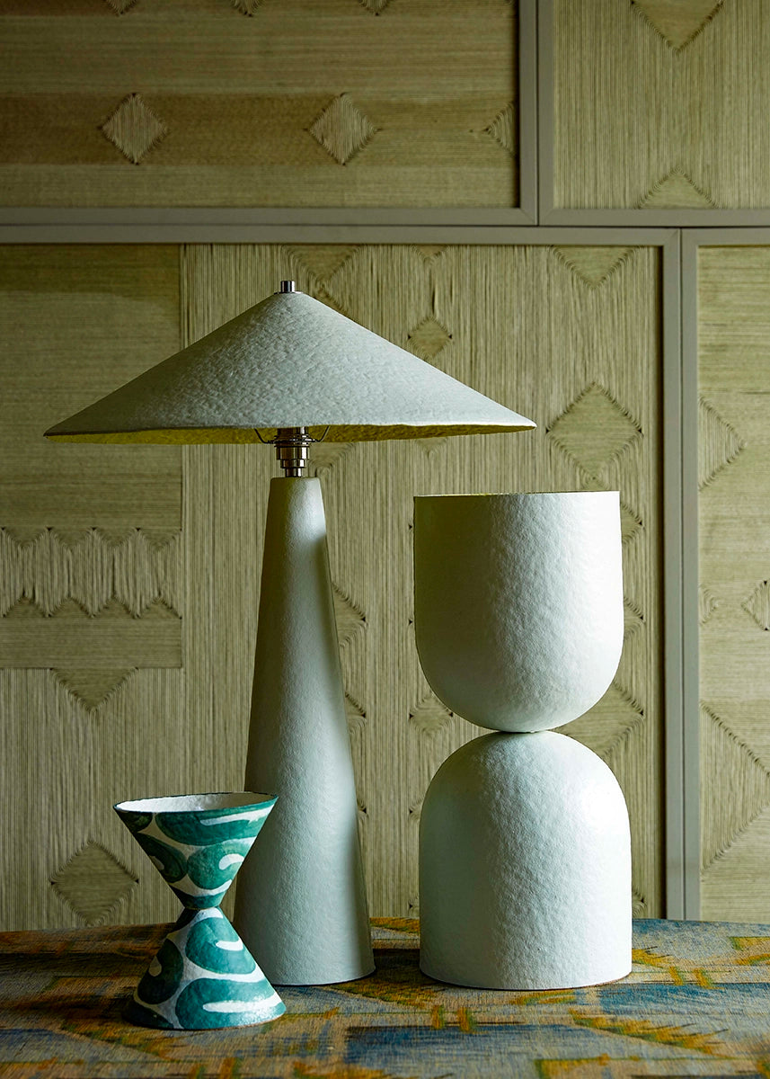 Set of table lamps against a textured wall.
