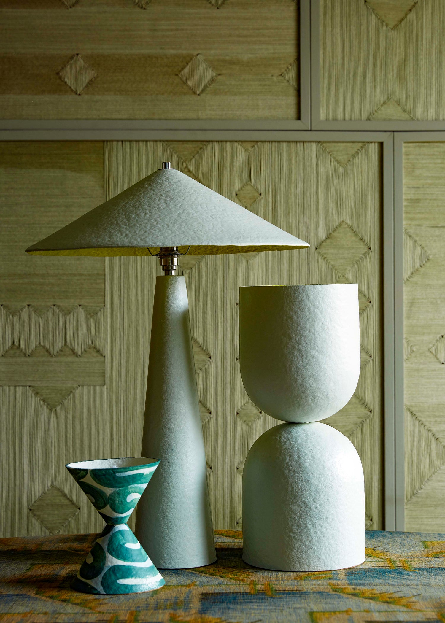Group of hand-painted table lamps - the Parasol and Hourglass in off-white and Diabolo in Serpent, made from paper pulp.