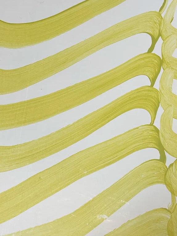 A card featuring abstract wavy yellow-green brushstrokes on a white background.