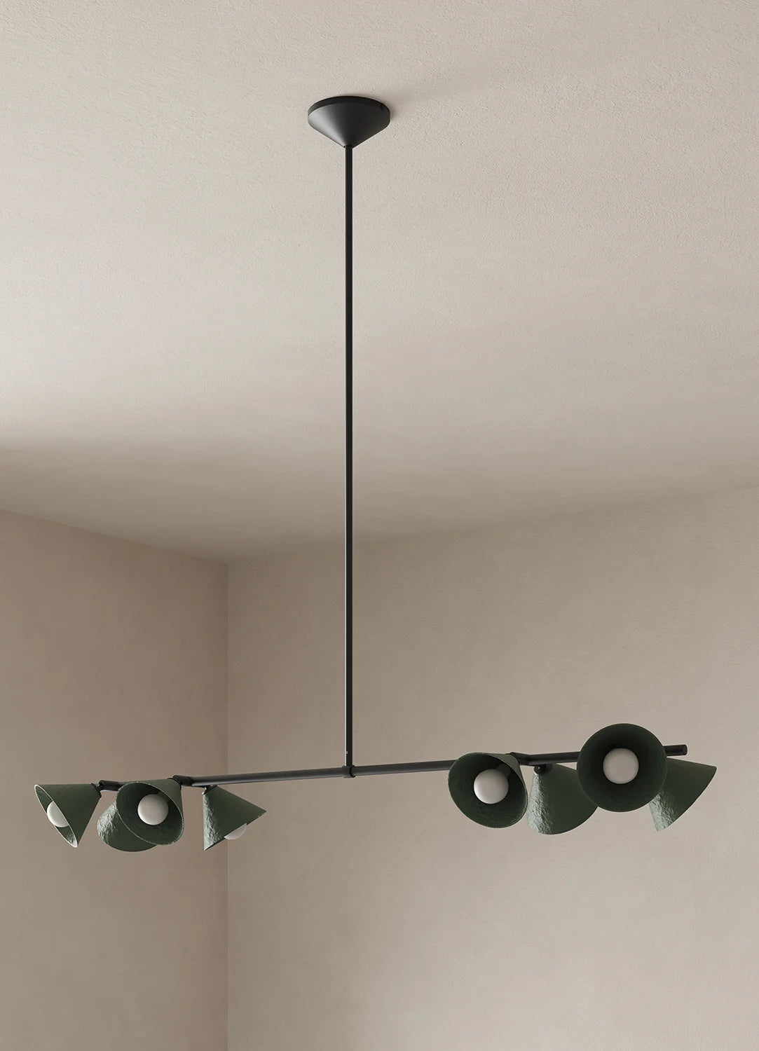 A modern linear chandelier with dark green conical shades and a black metal frame, suspended from a ceiling in a minimalist beige room.