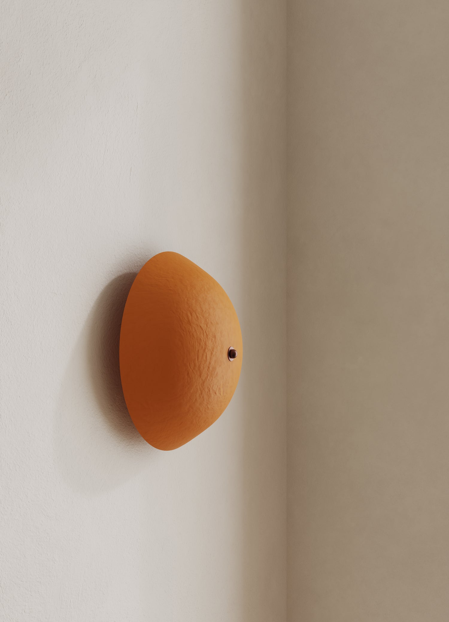 Wall-mounted domed light fixture with an orange shade and brown finial