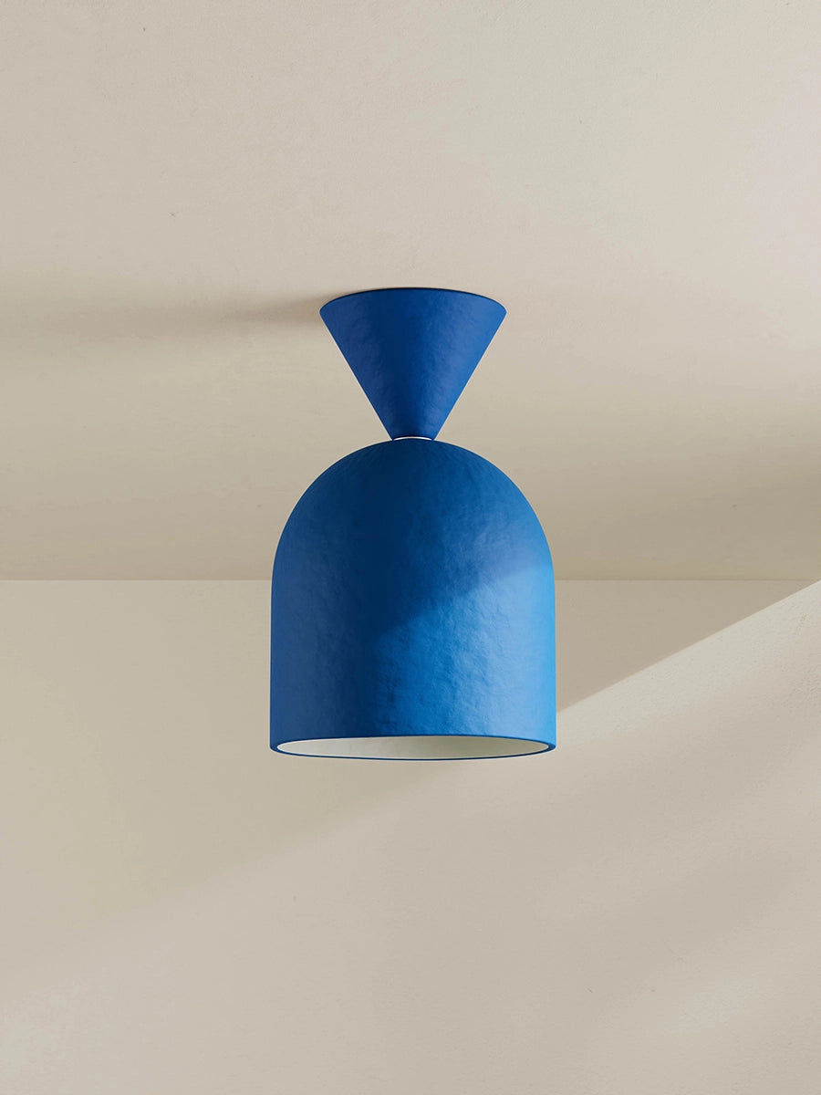 Blue ceiling light fixture on a neutral background