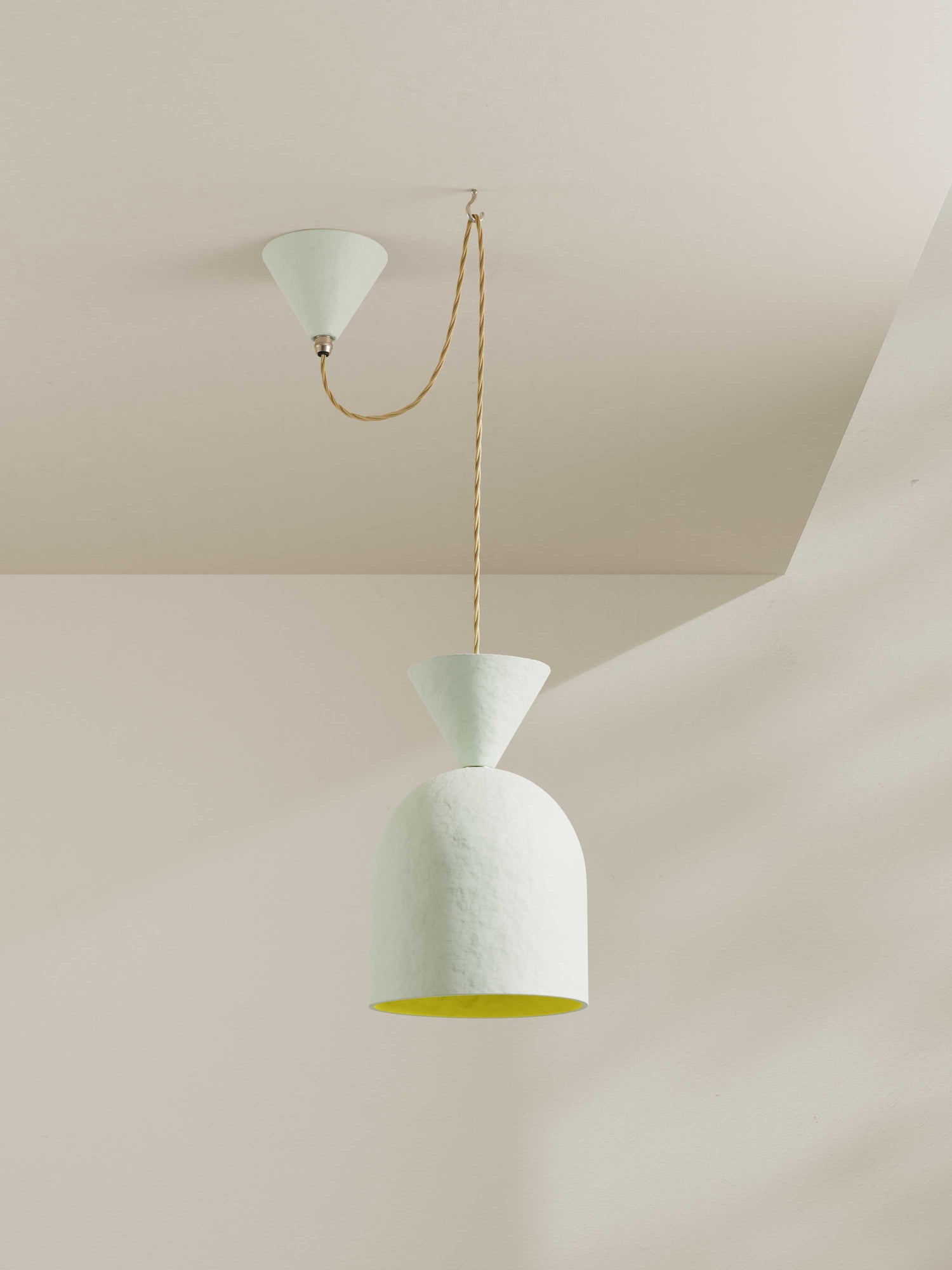 Bell Pendant ceiling light made of hand-painted paper pulp in off-white with bright yellow shade interior