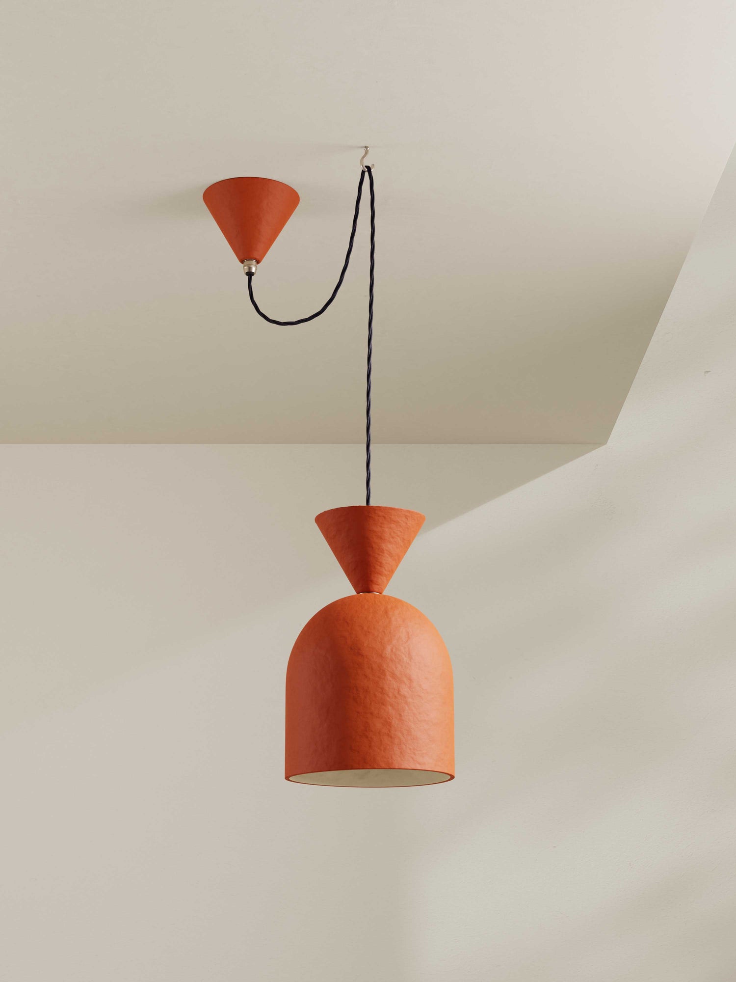 Bell Pendant ceiling light made of hand-painted paper pulp in orange/red hue with matching ceiling rose