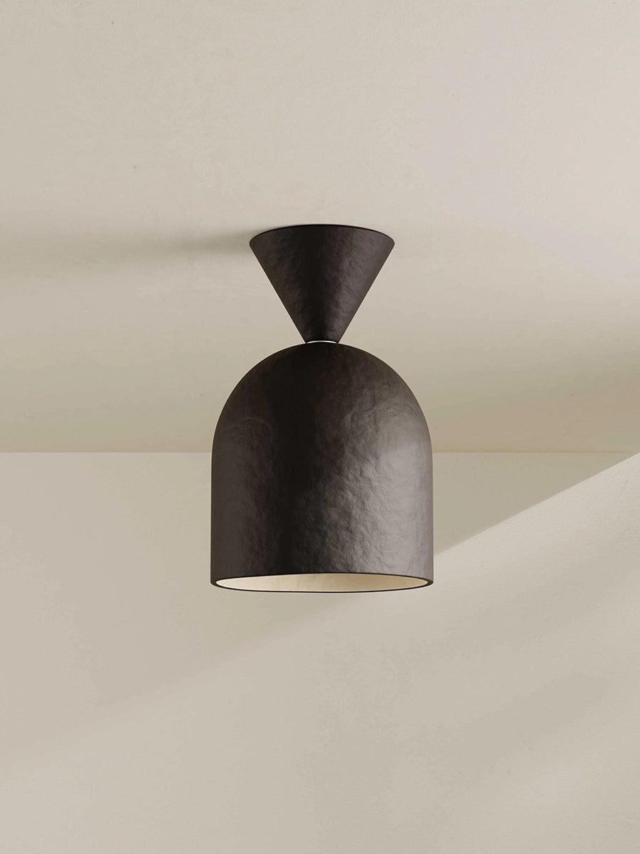 Modern brown-black ceiling light fixture on a neutral background