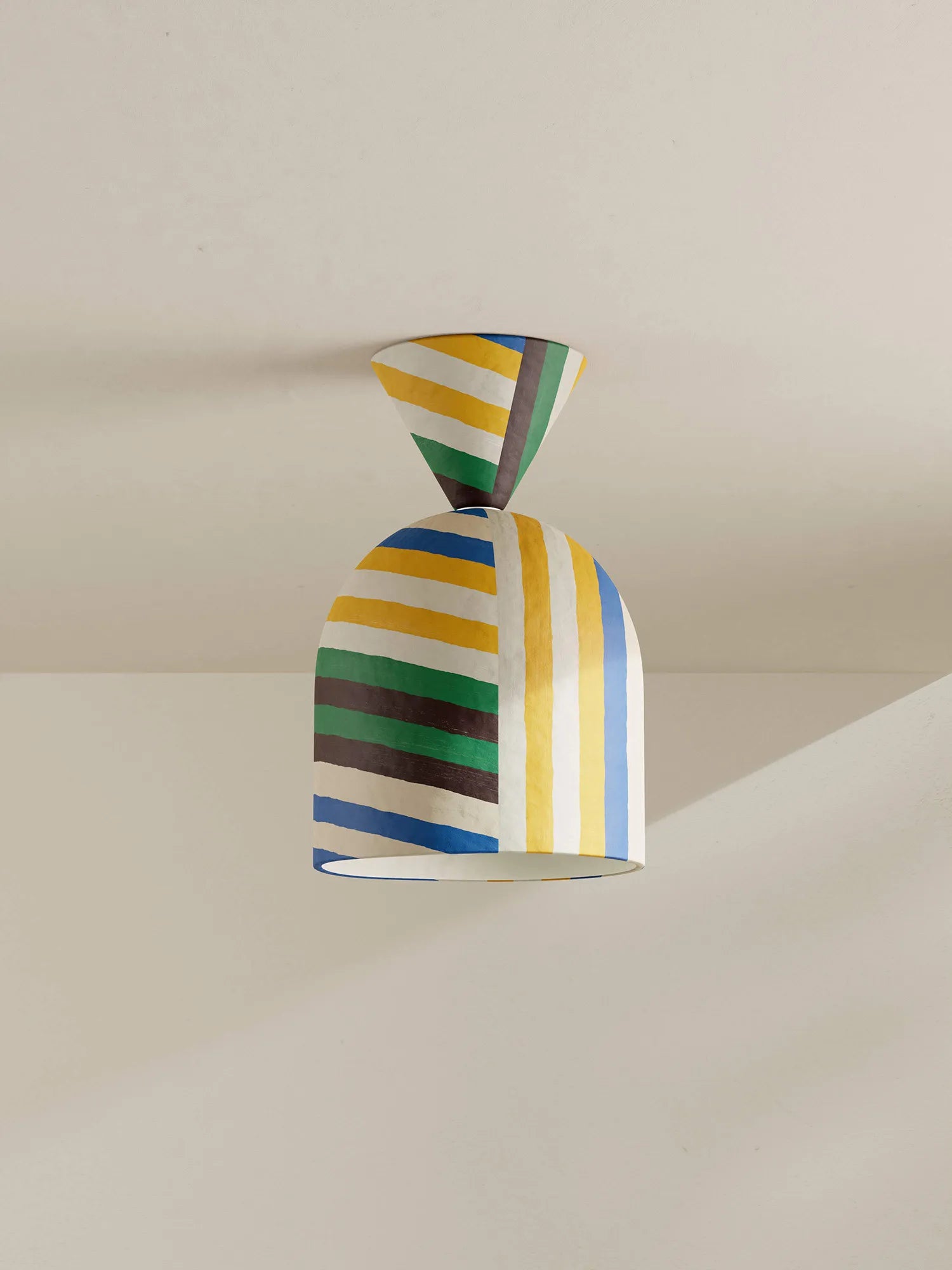 Colorful striped ceiling lamp on a neutral background