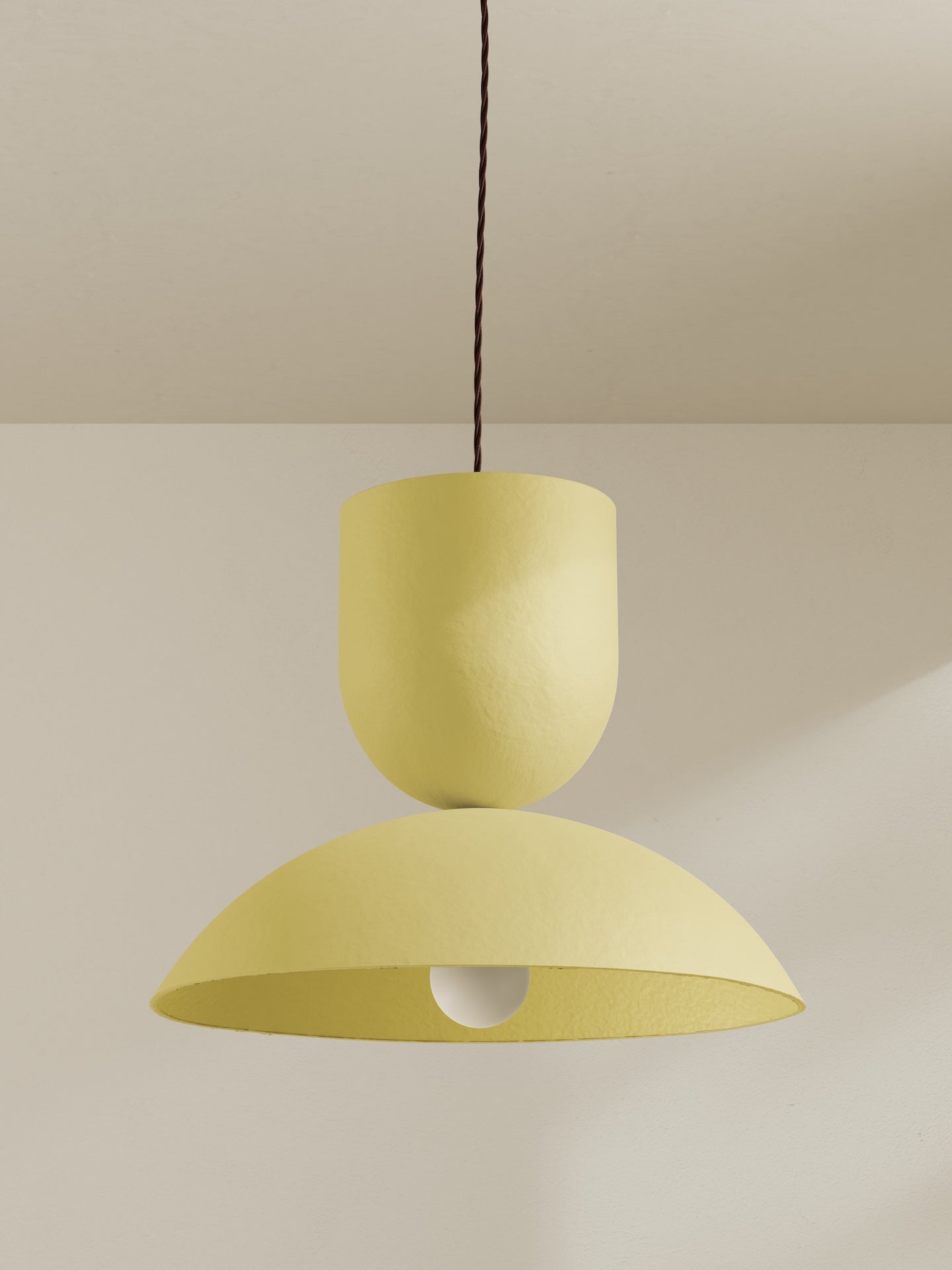 Buoy pendant, a large ceiling light made of paper pulp and hand-painted in sherbet yellow