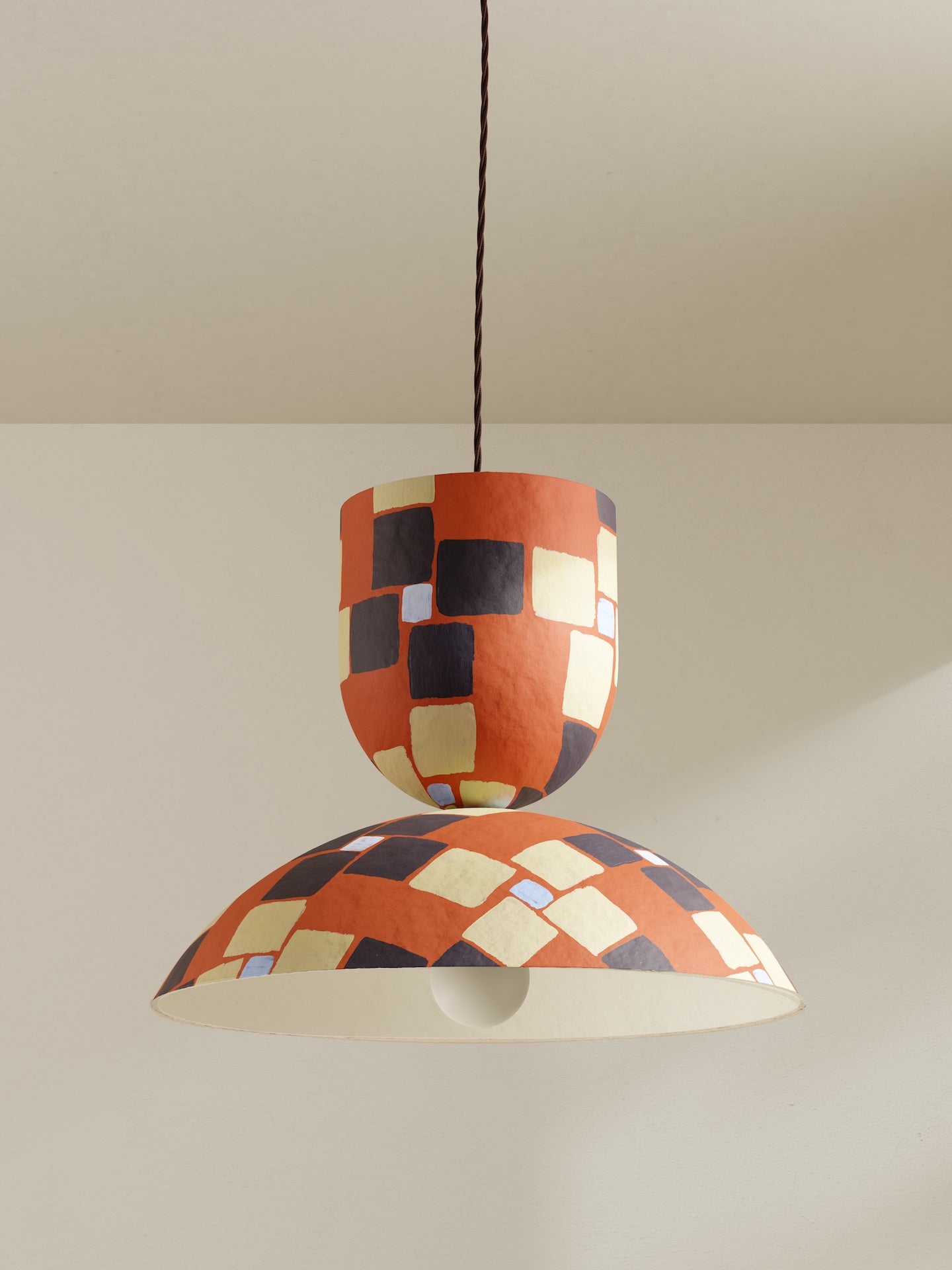 Buoy pendant, a large ceiling light made of paper pulp and hand-painted in orange mosaic Frieze pattern