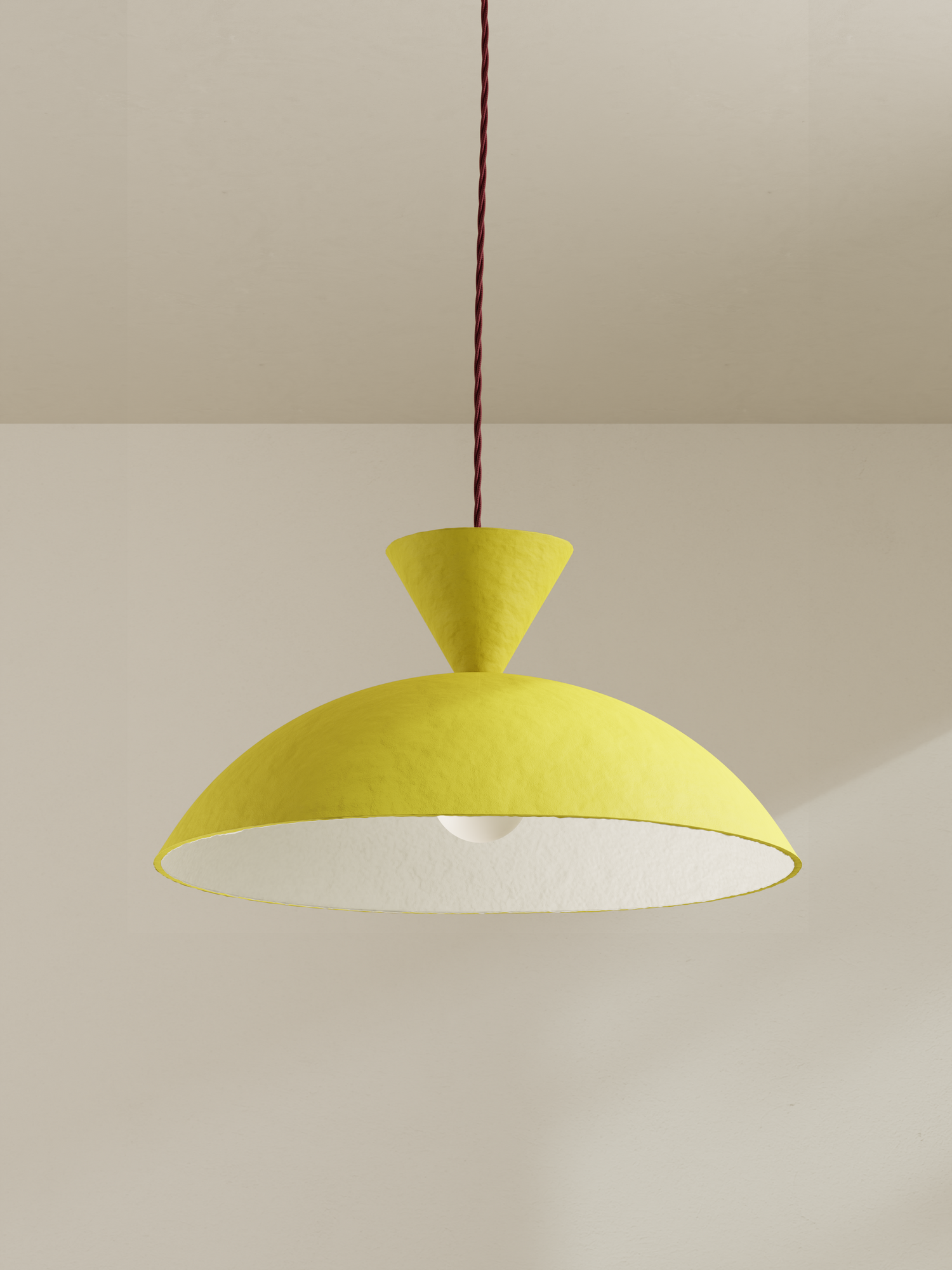 Cloche pendant, a ceiling light with a wide domed shade, made of paper pulp and hand-painted in bright yellow 