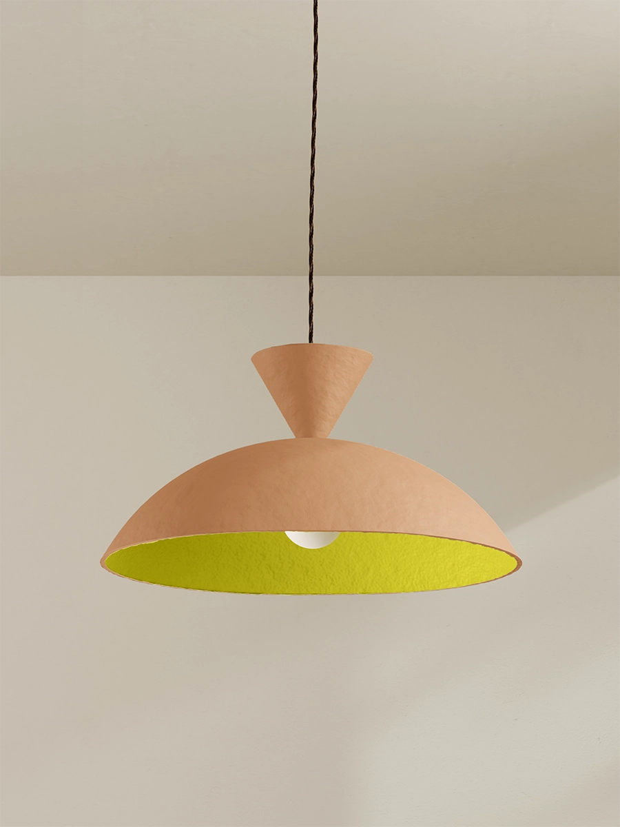 Pendant with yellow interior against plain background