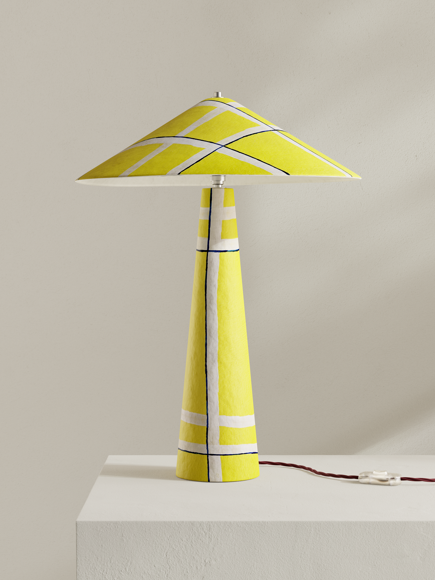 Parasol table lamp with tall stem and wide shade, made of hand-painted paper pulp in yellow Axis pattern 