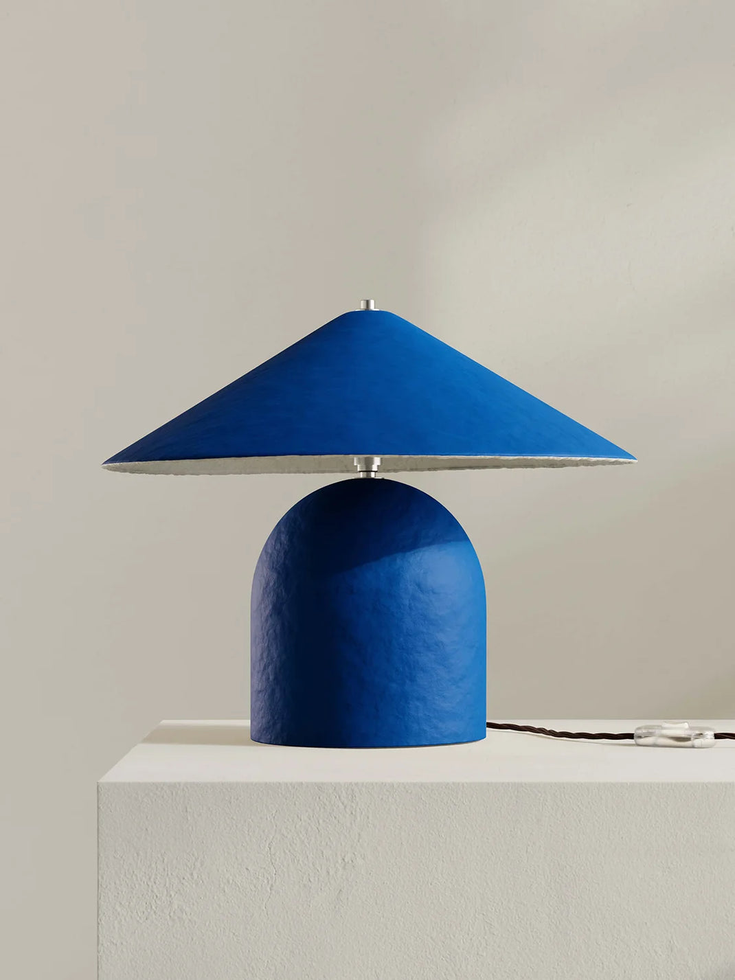 Blue table lamp on a light gray background