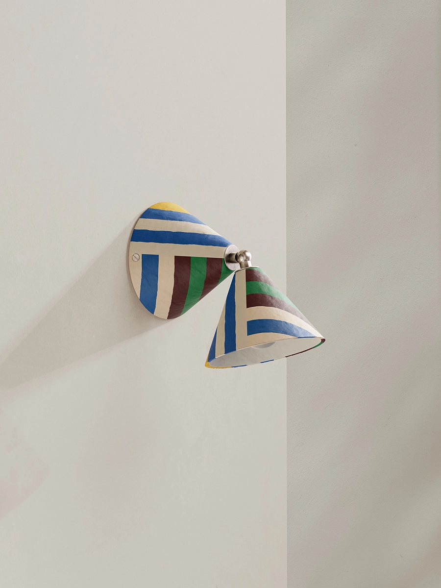 Colorful wall sconce on a neutral background