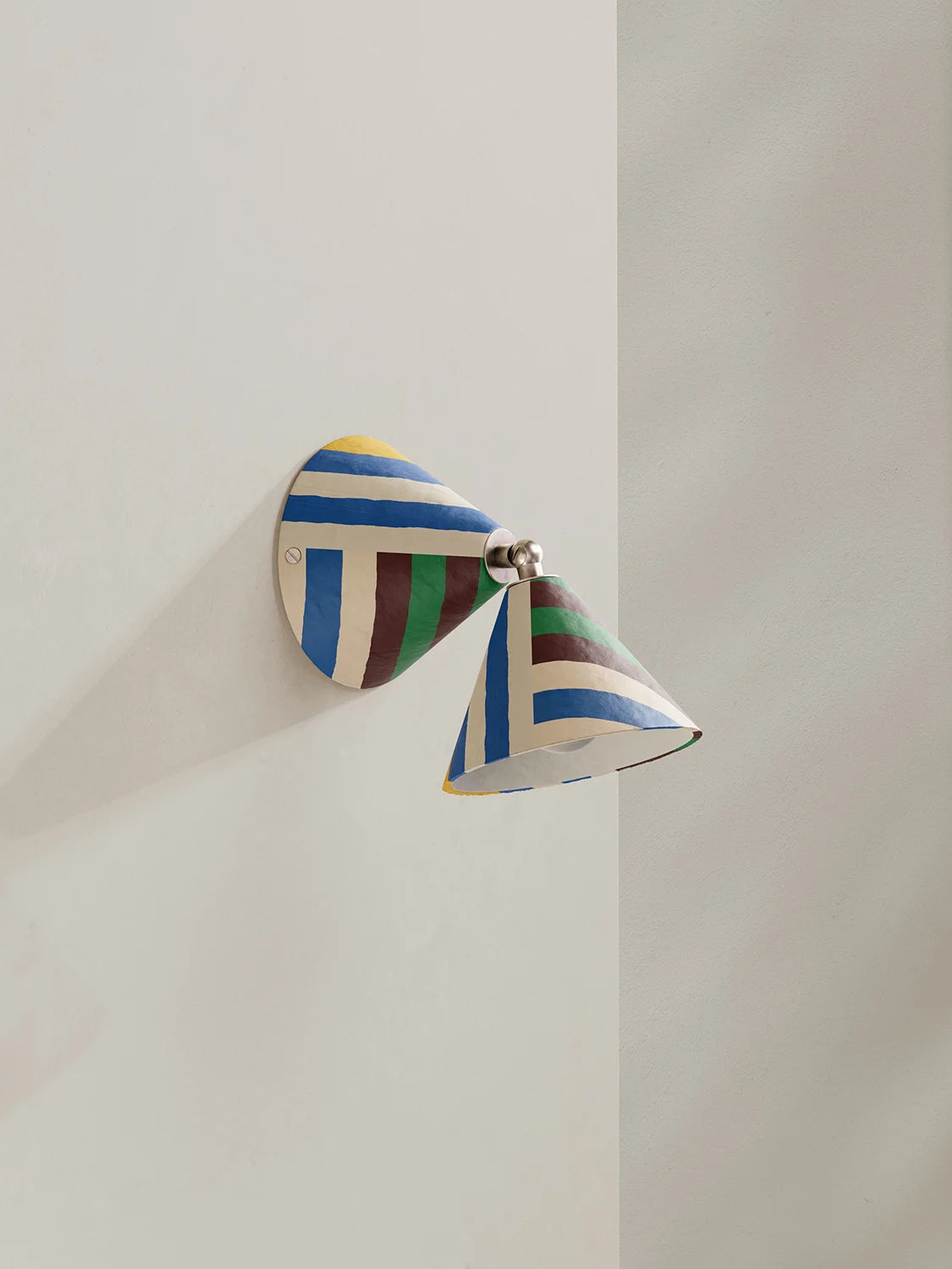 Colorful wall sconce on a neutral background