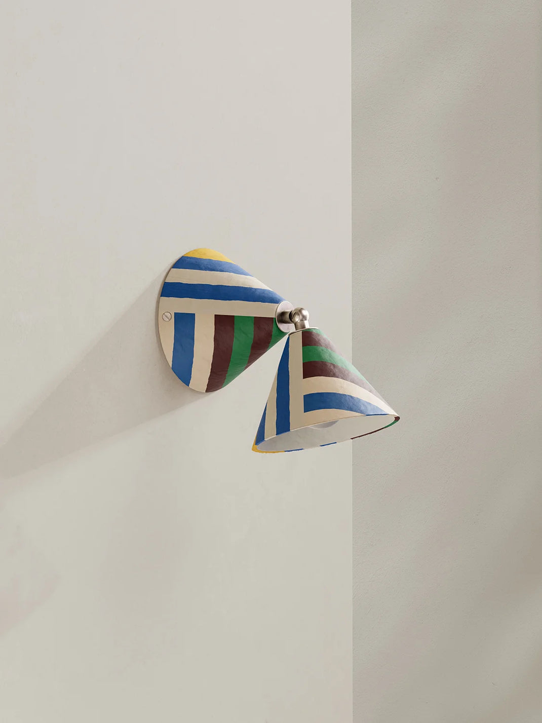 Colorful wall sconce on a neutral background