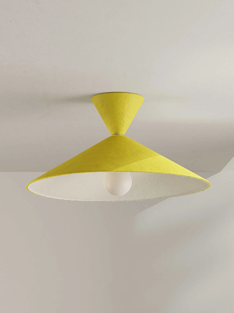 Yellow ceiling light fixture on a plain background