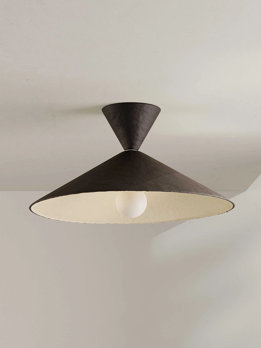 Modern ceiling light fixture on a neutral background